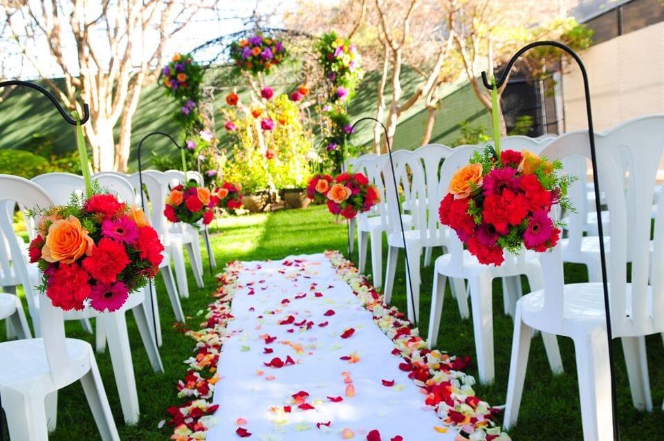 Decorated backyard wedding aisle
