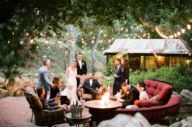 Backyard wedding fire pit gathering