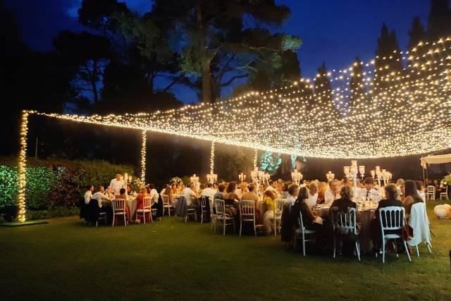 Backyard wedding with string light canopy