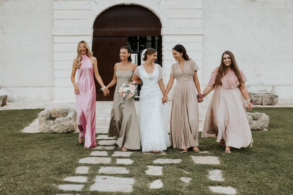 Bridesmaids holding hands