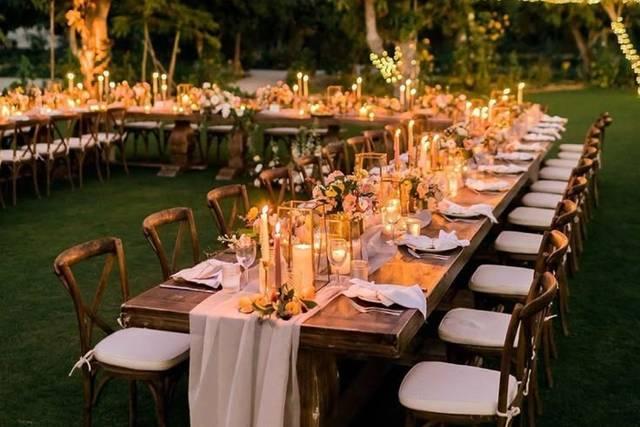 Candlelit garden wedding reception tables