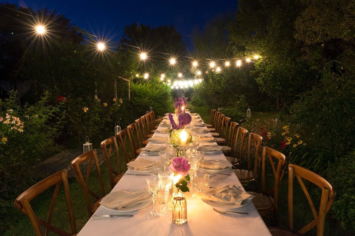Candlelit garden reception tables