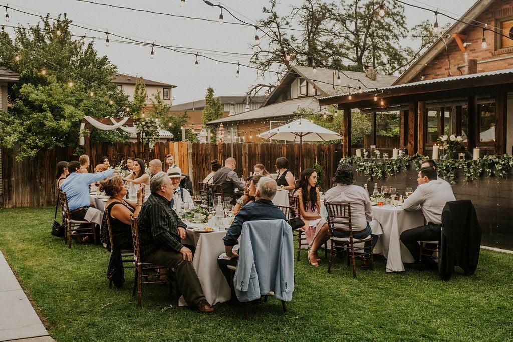 Family style outdoor wedding dinner seating