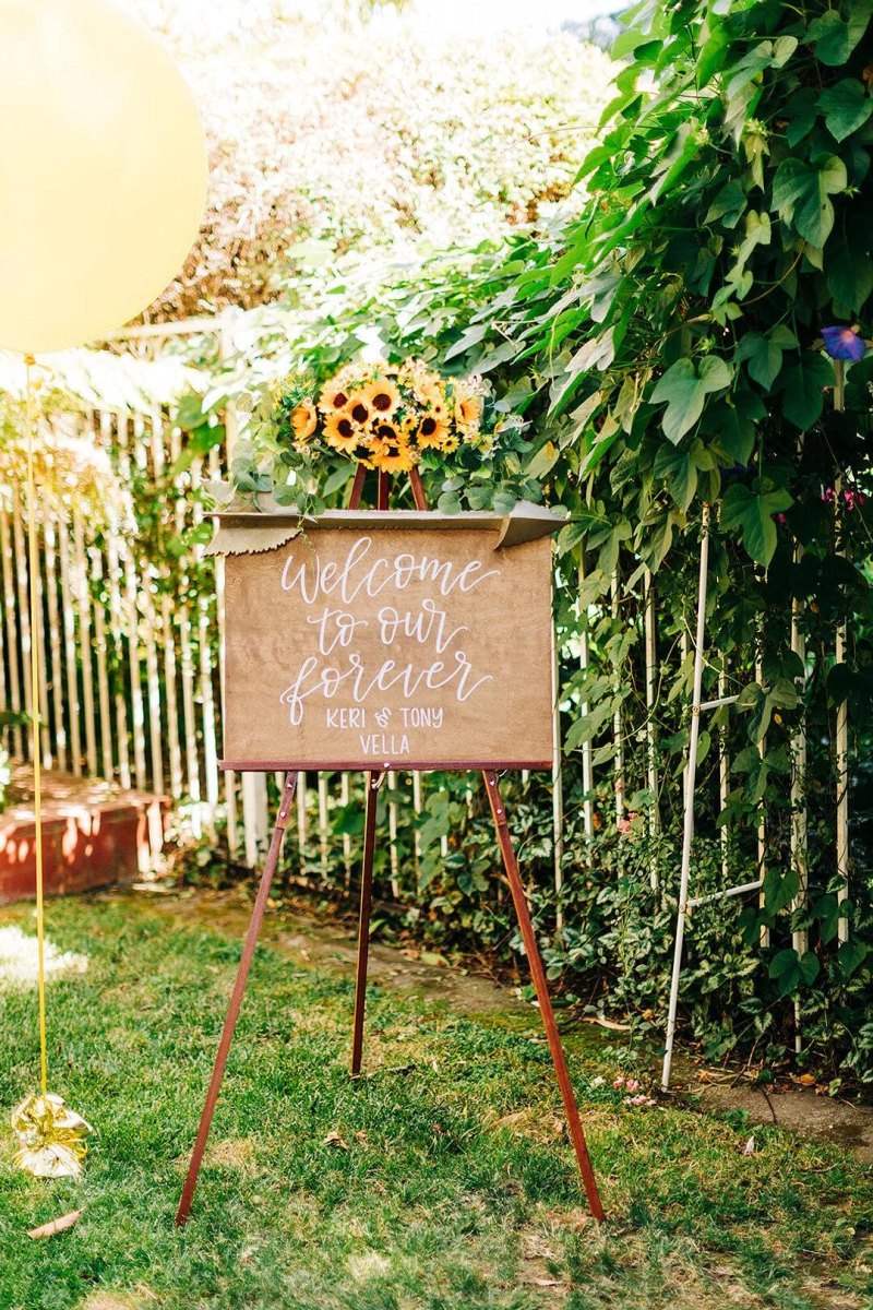 Creative wedding welcome sign outdoors