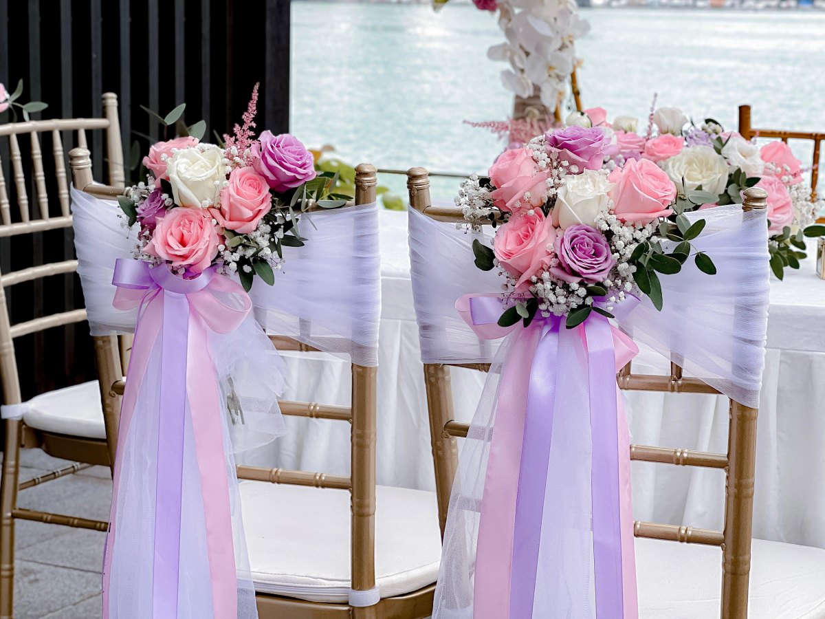 DIY decorated wedding reception chairs