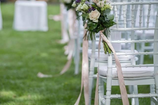 Elegant wedding chairs with floral decor