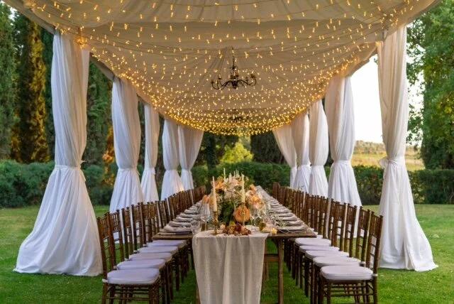 Backyard wedding fairy light canopy reception