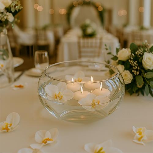 Floating candles in glass wedding reception display