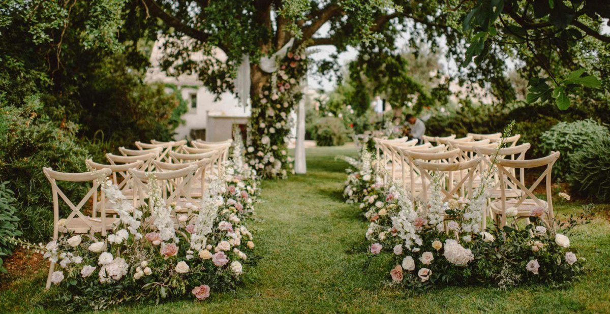 Floral aisle at garden wedding