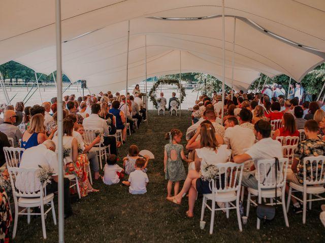 Outdoor wedding guests under shade