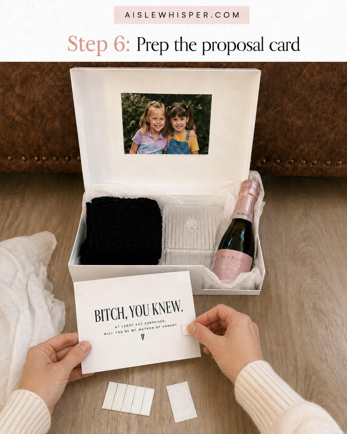 Hand preparing the printed proposal card that reads Bitch you knew for the matron of honor box