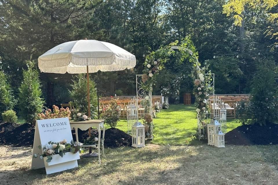 Wedding signs in backyard ceremony area