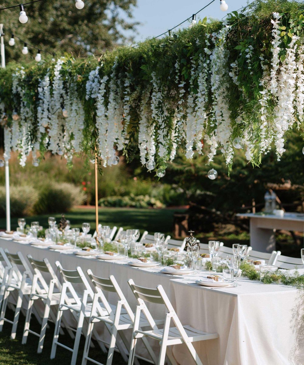 Hanging floral backyard wedding installation