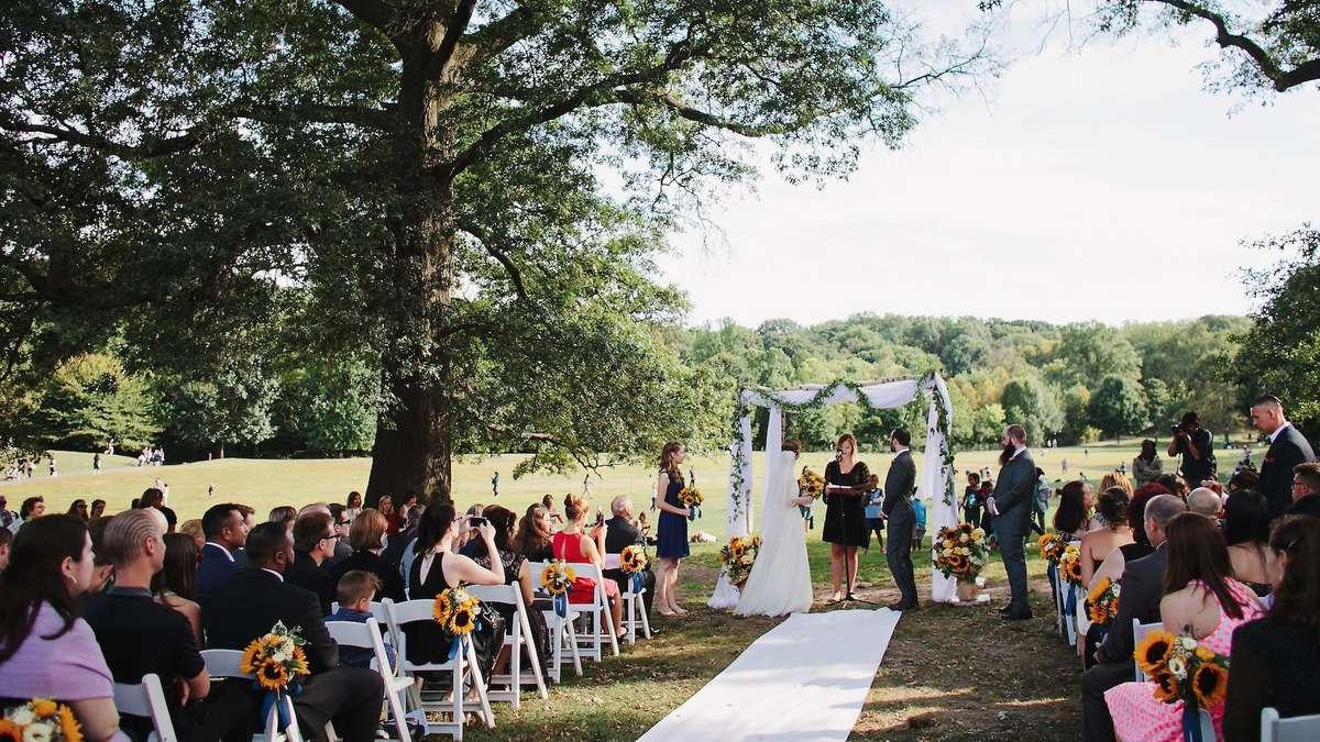Park wedding ceremony trees flowers