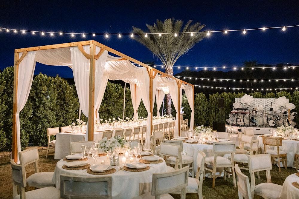 Backyard wedding string light canopy