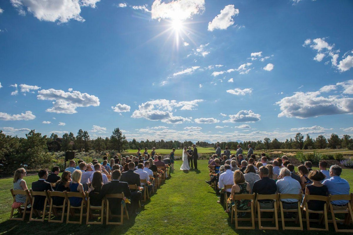 Outdoor wedding ceremony in harsh sunlight