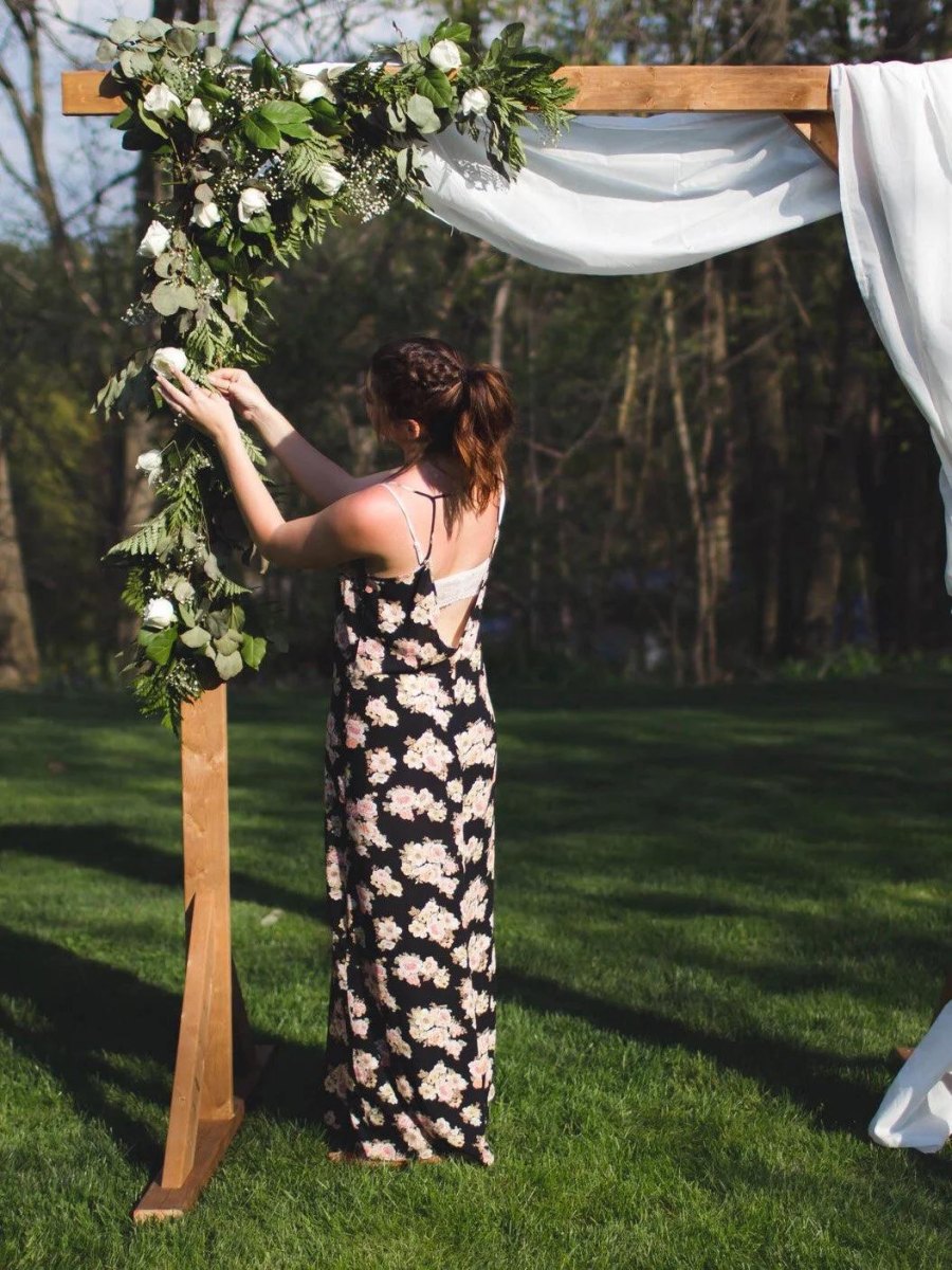 Simple DIY wedding arch with flowers