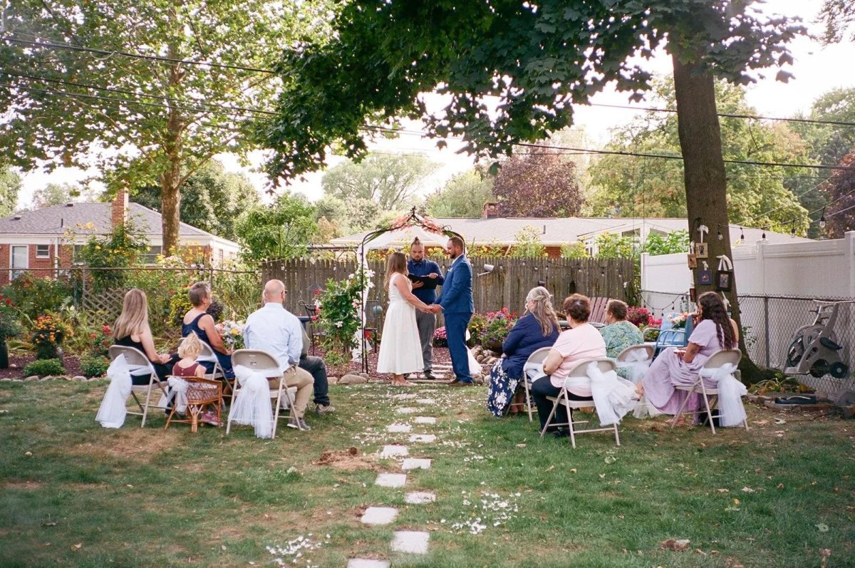 Family seating at small backyard wedding