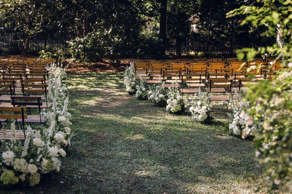 Floral backyard wedding aisle