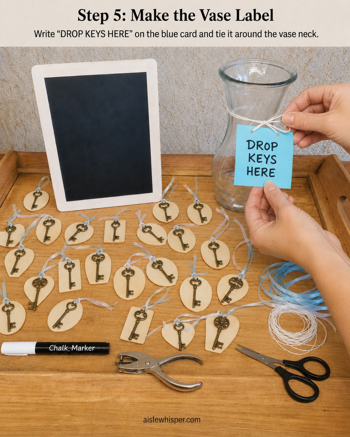 A glass vase labeled Drop Keys Here with twine, part of a small wedding guest book alternative