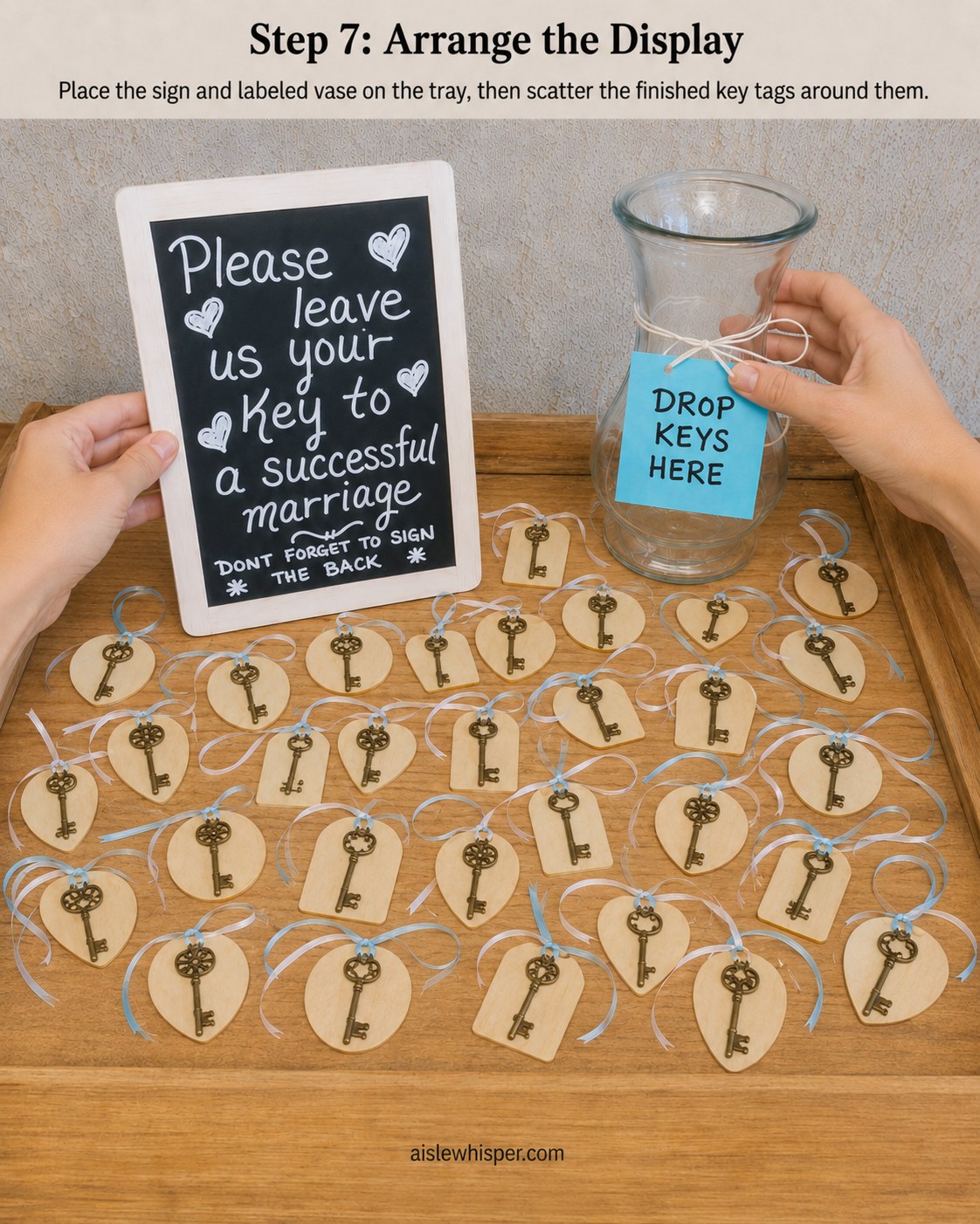 Chalkboard sign and labeled vase staged on a wooden tray with scattered vintage key wedding favors