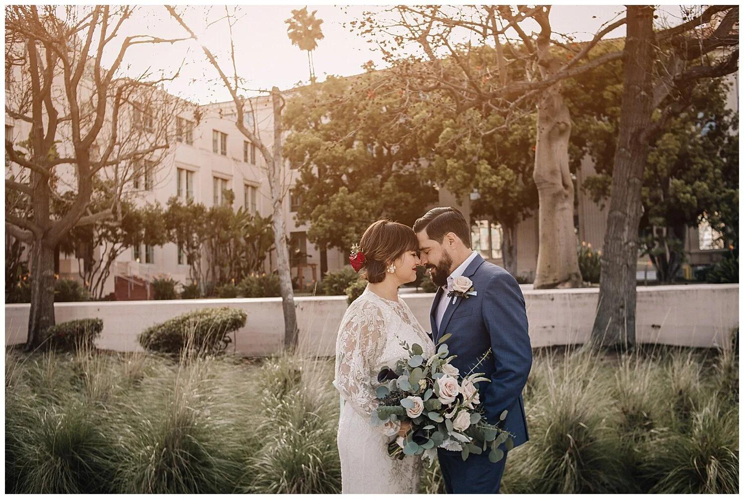 Couple taking sunset courthouse portraits